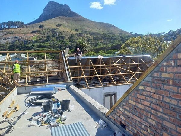 Timber roof trusses going up beneath Lion's Head