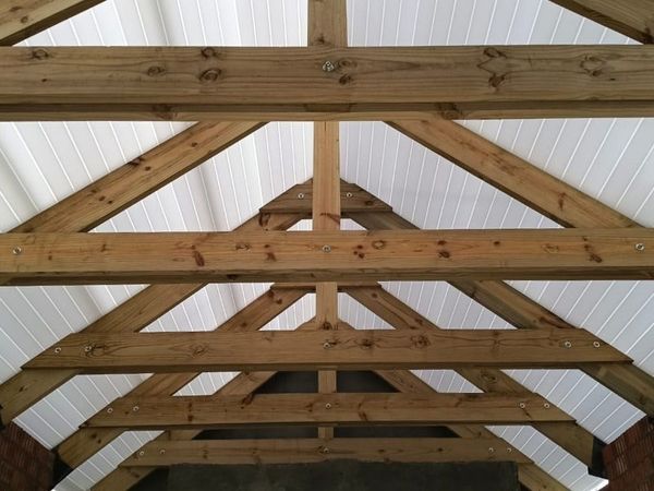 Pre-assembled timber roof trusses inside a new build