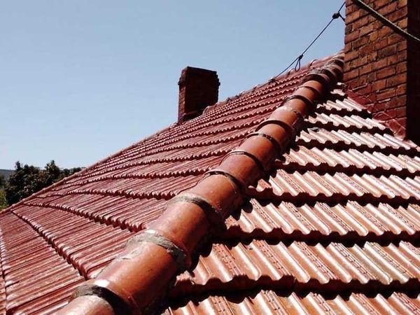 Tiled roof after roof cleaning and painting work