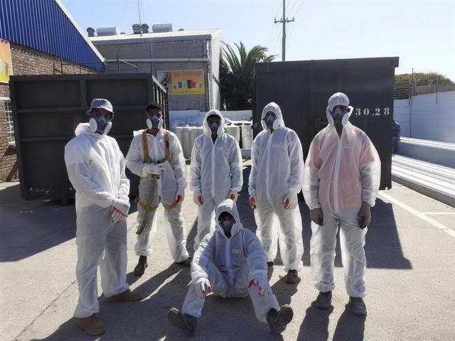 Rome Roofing asbestos removal team in protective suits